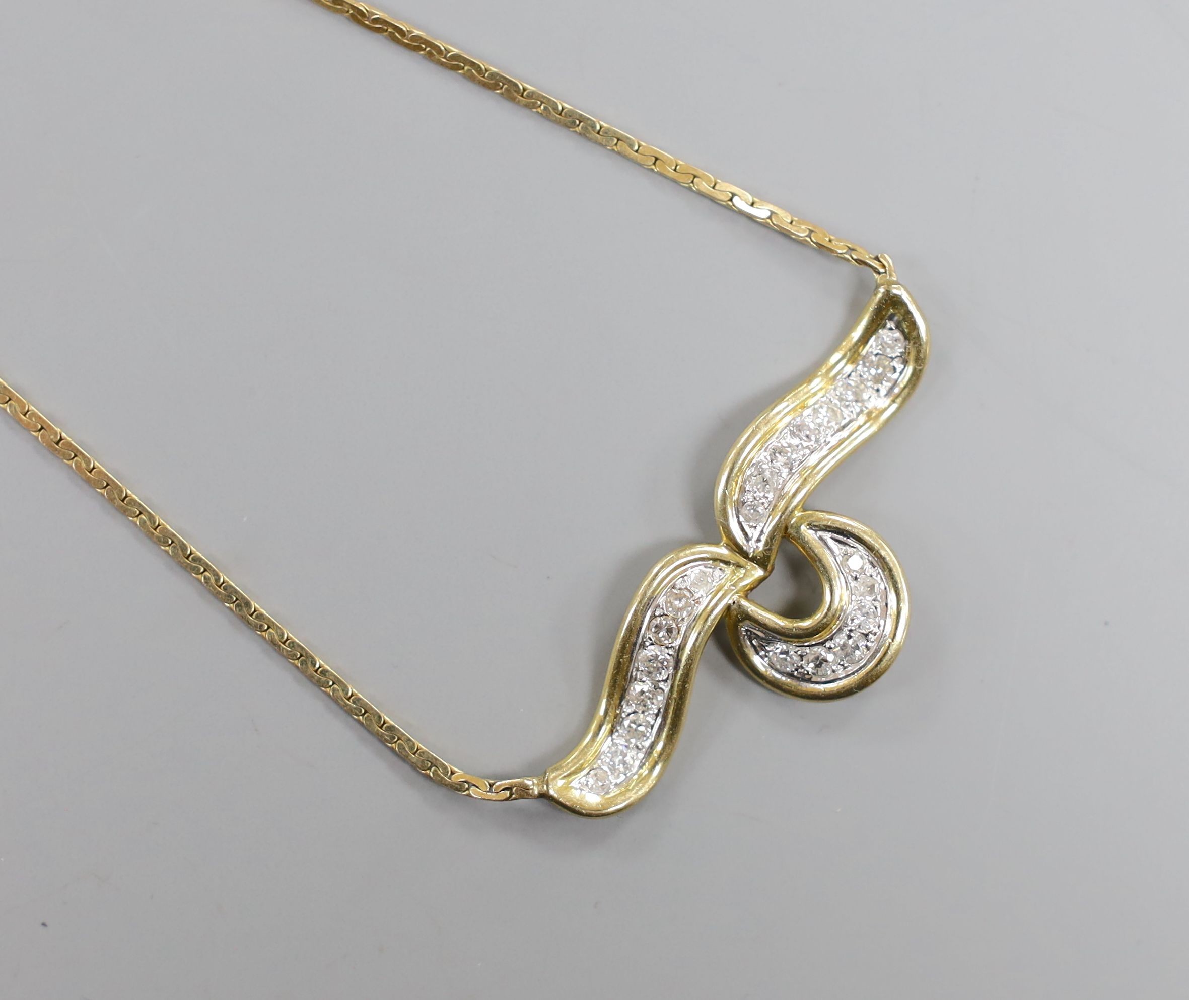 A modern 14k yellow metal and diamond cluster set necklace, 36cm, gross 10.4 grams.